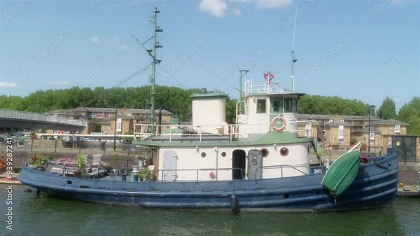 Moored Tug Boat. A steam tug moored in a marina.