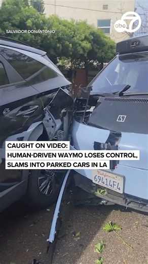 @abc7newsbayarea on Instagram: "Surveillance video shows the moments a new van-like Waymo model that was in "manual driving mode" with a specialist behind the wheel was seen wildly careening up an embankment in an LA neighborhood, taking out a street sign before smashing into several parked cars. One man nearby narrowly missed getting hit and cellphone video showed the front bumper of the car severely damaged, and the airbags blown inside. Read the full story here by tapping our link in bio @abc