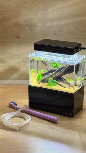 Pavol Štefančík on Instagram: "Water change in the world Smallest tank ? Mini Complete Tank 💦🙂 Capacity: 680 ml 🙊 Hardscape: @jbl.de Sansibar Orange 🧡 #minicompletetank #waterchange #small #aquarium #aquascaping"