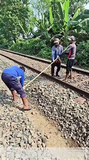 Forging Stability: How Three Workers Master the Railroad Bed