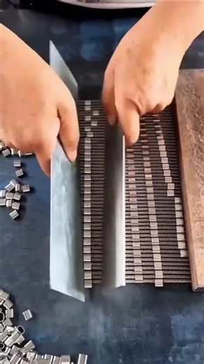 Brillianttechmech on Instagram: "Manual Precision: The Art of Speed Sorting! 🖐️⚡ ​Prepare to be mesmerized by the incredible speed and rhythm of this manual assembly process! This worker is using a simple hand tool to align and load small metal fasteners (likely zipper stops or wire clips) onto carrier rails with machine-like efficiency. ​The Efficiency of Low-Tech Tooling ​This video demonstrates that you don't always need robots for high-speed manufacturing; sometimes, a clever "jig" is all i