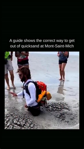 KNOWLEDGE | DECODED on Instagram: "Dealing with quicksand is a real‑world lesson in non‑Newtonian fluid dynamics. Quicksand is a supersaturated mix of sand and water that looks solid until pressure is applied, at which point it loosens and behaves more like a liquid. The more you thrash, the more you force water away and compress the sand around your legs, increasing friction and creating a strong vacuum effect. To get out, you need to lean back to spread your weight over a larger area so you st
