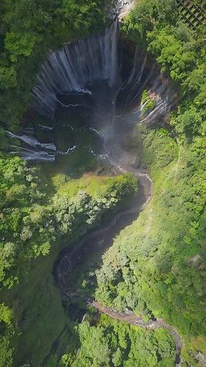 Scenic Echo on Instagram: "Tumpak Sewu Waterfalls - A Gateway to Nature’s Grandeur 🌿💦 Hidden in the heart of Lumajang, East Java, Indonesia, Tumpak Sewu (meaning “a thousand waterfalls”) stands as one of nature’s finest masterpieces. This mesmerizing cascade, shaped like a semi-circular curtain, is often called the “Niagara Falls of Indonesia,” and for good reason. The sheer power of water rushing down from a height of 120 meters is an experience that ignites awe. The lush greenery enveloping 