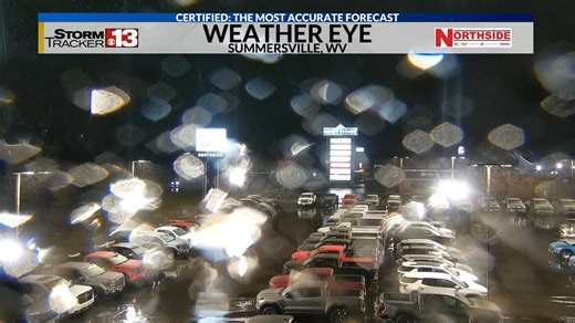 IT'S SNOWING! Yes, it's March 26th at 2:30am and the snow is coming down at Summersville...you can see it in the lights! | StormTracker 13