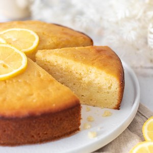 2.8K views · 41 reactions | Lemon Syrup Cake  RECIPE https://recipesbycarina.com/lemon-syrup-cake/ A soft and delicate lemon yoghurt cake, drizzled with a tangy lemon syrup. Perfect served with a dollop of yoghurt | Recipes by Carina | Facebook