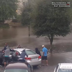 When a car stalled in flood waters caused by Hurricane Matthew in Walterboro, South Carolina, this morning, a group of neighbors stepped in to help. | CNN