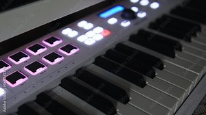 Keys electronic synthesizer with buttons lighten up closeup. High quality 4k footage