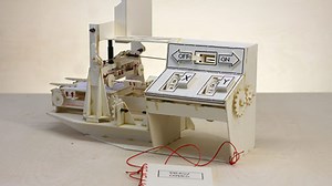 Artist crafts intricate drawing machine from cardboard and tape