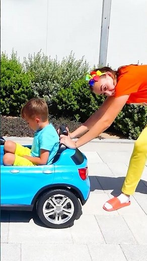Mom helps Niki with the car