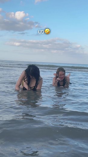 Playful Water Fun Between Friends at the Beach