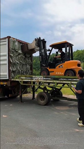 Hardcore logistics! Forklift packs container completely full.