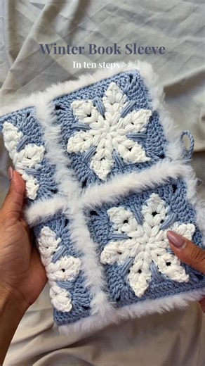 nav | crochet 🧶 🧚🏼‍♀️ | winter book sleeve step by step ❄️ 🩵 snowflake granny square pattern is out now 👀 yarn from @spotlightstores - Moda Vera Otis Faux in... | Instagram