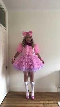 Frilly sissy doll in pink dress