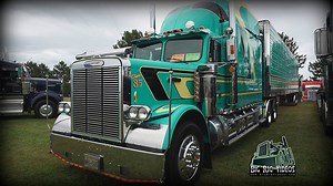 This jem was on display at the 2015 Rodéo du Camion truck show in Norte Dame du Nord, Quebec, Canada. It's a 1985 Freightliner FLD 120 that belongs to John Camposeo Trucking. It has a Caterpillar 400 / 110" bunk, complete with hardwood floors and a fireplace. | Big Rig Videos