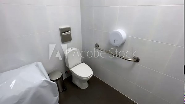 Public inclusive toilet (WC) in a clinic or hospital for people with disabilities. Extreme wide angle view