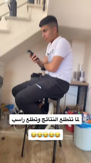 Young Man Engaged on Smartphone in Casual Setting