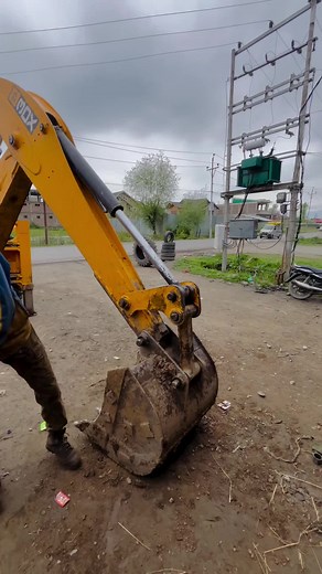 JCB Backhoe Loader in Action at Construction Site