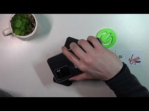 Size comparison between OPPO A77 phone and human handheld