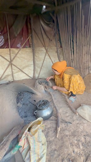 The kitchen in a Berber tent in the Merzouga desert of southern Morocco reflects a simple, practical way of life deeply connected to the Saharan environment.Inside the tent, a traditional structure made of camel or goat wool, the kitchen typically occupies a corner of the interior or an outdoor space sheltered from the wind. There, the women prepare food over a wood or charcoal fire, using clay or metal pots. #inspirationofafrica | Quim Fàbregas