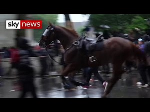 Officer knocked off horse during clash with BLM protesters in London