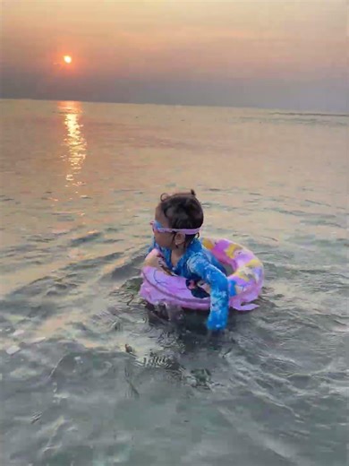 What a Brave Toddler swimming with the waves