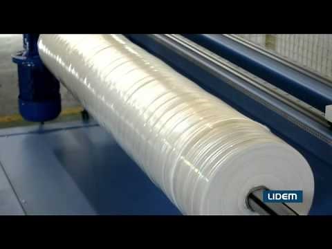 Roll cutter or slitter with pneumatic shaft and automatic positioning for nonwoven, fabric, plastics