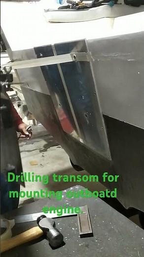 drilling 4 holes with transom guide for mounting outboard engine.