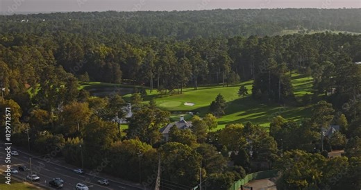 Augusta Georgia Aerial v30 low birds eye view, flyover capturing the landscape of National Golf Club with pristine lake environment and intricate course layout - Shot with Inspire 3 8k - October 2023