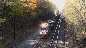 A Norfolk Southern loaded coal train roars up the grade through Cassandra, Pennsylvania on the company's Pittsburgh Line on a warm autumn afternoon 🍂 ➡️ Follow Trainiac Productions for more original train content! #trainiac #railfan #trainspotting #trains #railways | Trainiac Productions