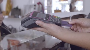 Shop Cashier Inserting Credit Card in Pos Terminal