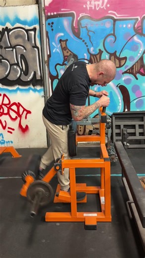 Westside Barbell standing leg curl.
