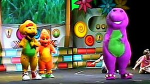 Boneka Barney Hibur Keluarga Indonesia