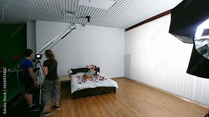 The shooting process of the couple in the bed. time lapse