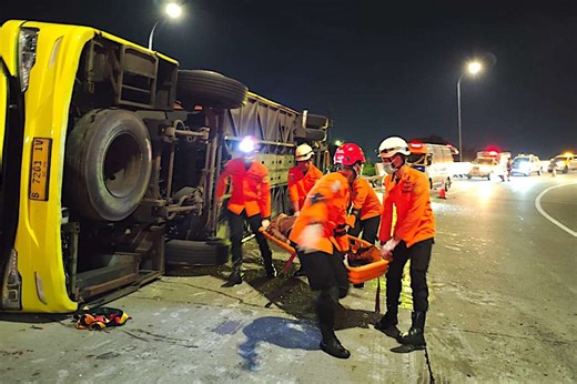 At least 16 people dead and multiple others critically injured after bus smashes into guardrail and flips over