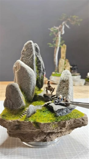 Golden Stone Landscape Art is a Chinese miniature artist who builds intricate landscapes from stones, moss-like greenery, and natural textures. He precisely places each rock to shape mountains and terrain, then applies adhesive and fine green materials that resemble grass and vegetation, slowly bringing every scene to life. Artist: mj15006597 / 金石造景 on Douyin #art #artist #miniature | Sketch Daily Dose