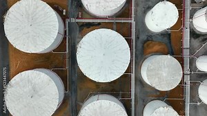 Top down aerial of huge bulk fuel storage tanks for oil, gas, home heating oil.