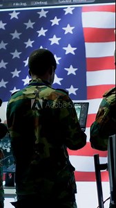 Vertical Video Military personnel work in a high tech environment safeguarding classified data and managing cybersecurity operations to defend against cyber attacks and digital warfare threats. Camera