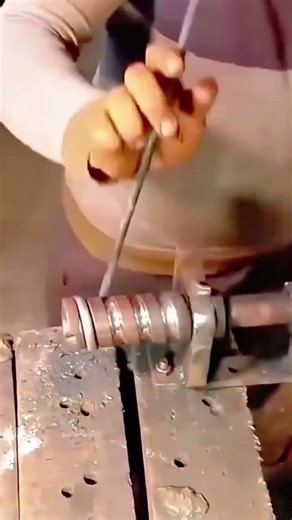 Manually Bending a Thick Metal Rod into a Precise Coil Spring