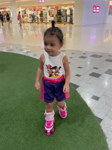 Toddler learning to roller skate