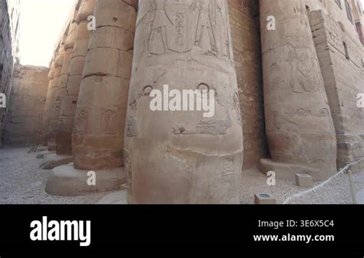 Low angle view of massive ancient stone columns with intricate hieroglyphic carvings at the historic Luxor Temple in Egypt Stock Video Footage - Alamy