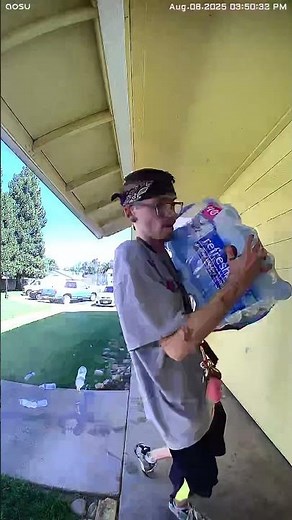 Bag of Water Bottles Breaks, Spilling on Ground