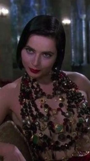 Spitfire Girl on Instagram: "In Death Becomes Her (1992), Isabella Rossellini delivers an unforgettable performance as Lisle Von Rhuman, the mysterious, ageless enchantress who holds the secret to eternal youth. Draped in lavish costumes and exuding otherworldly glamour, Rossellini’s portrayal is equal parts seductive and commanding. As the keeper of a life-extending elixir, her character becomes the catalyst in the film’s darkly comedic tale of vanity, immortality, and rivalry. With her hypnoti
