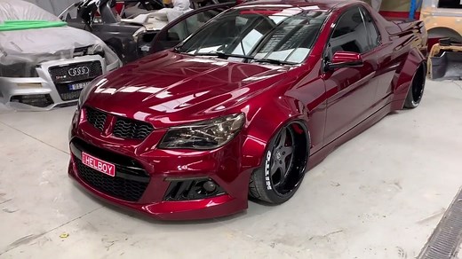Sneak peek at this candy apple red widebody Holden Maloo!! 😈 Done by Queen Street Customs. - Custom wide body - RSV forged wheels - Air suspension - Custom doors - shaved handles, push button entry - Hell boy air brushing - Everything blacked out - Interior re-trim - Digital processor with tv unit. - Custom tray and tub lining trim Video from Toughest Cars | Street FX Motorsport & Graphics