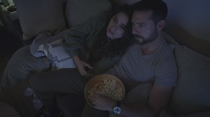 Loving couple watching a movie together - Free Stock Video