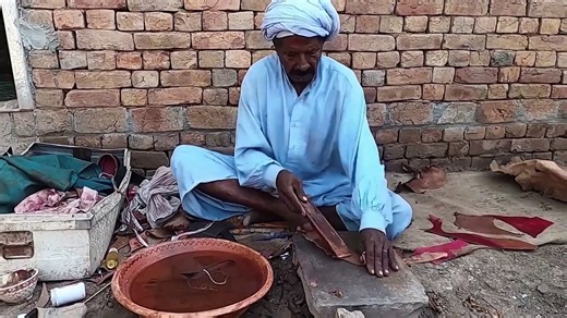 Making of Primitive Leather Shoes by aged Villager Man