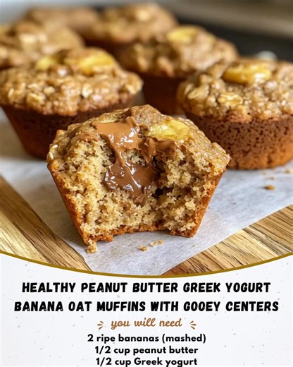 Healthy Peanut Butter Greek Yogurt Banana Oat Muffins with Gooey Centers Ingredients: 2 ripe bananas (mashed) 1/2 cup peanut butter 1/2 cup Greek yogurt 1/4 cup honey or maple syrup 1 egg 1 teaspoon vanilla extract 1 cup oat flour 1/2 teaspoon baking powder 1/4 teaspoon cinnamon 1/4 cup dark chocolate chunks (for centers) Directions: Preheat oven to 350°F (175°C) and line a muffin tin. Mix bananas, peanut butter, yogurt, honey, egg, and vanilla until smooth. Add oat flour, baking powder, and cin