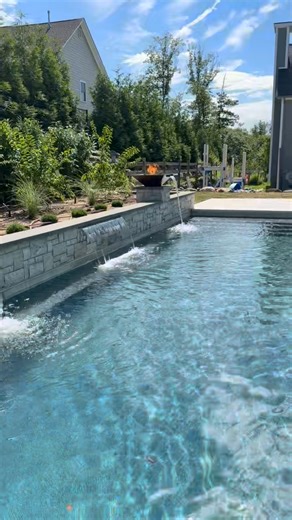 Caribbean Blue Pools & Spas on Instagram: "🔥💦 When fire meets water, and design meets precision — you get this. This isn’t just a pool — it’s a statement. Built by Caribbean Blue Pools, this backyard features: ✨ A bold feature wall 🔥 Fire bowls with cascading scuppers 🌴 Full-scale custom landscaping Every element was designed to create an immersive, resort-style escape — right at home. 💬 DM us to turn your backyard into the ultimate luxury destination. Because with Caribbean Blue Pools, you