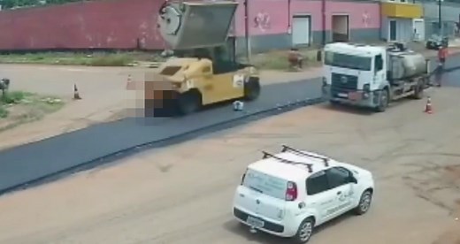 The moment worker is fatally crushed by both rollers on quick-moving steamroller