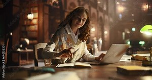 Cinematic Footage of a Stylish University Graduate Using Laptop Computer in a Public Reading Hall. High School Scholar Browsing Internet, Reading Library's Digital Collection