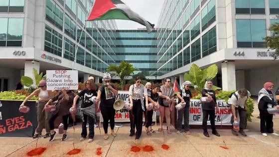 Pro-Palestine Protesters Pour Fake Blood Outside News Offices in DC
